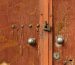 aged-wooden-doors-with-rivets-metal-lock_23-2148394622
